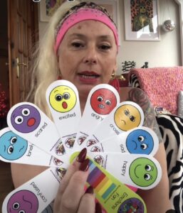 Nikki Gardiner holding feeling cards - Children's Yoga